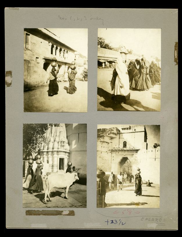 Black and white photographs. Four images are affixed to grey paper. They show people carrying round vessels balanced on their heads, singly, in pairs, or in groups. The bottom left image includes a white cow.